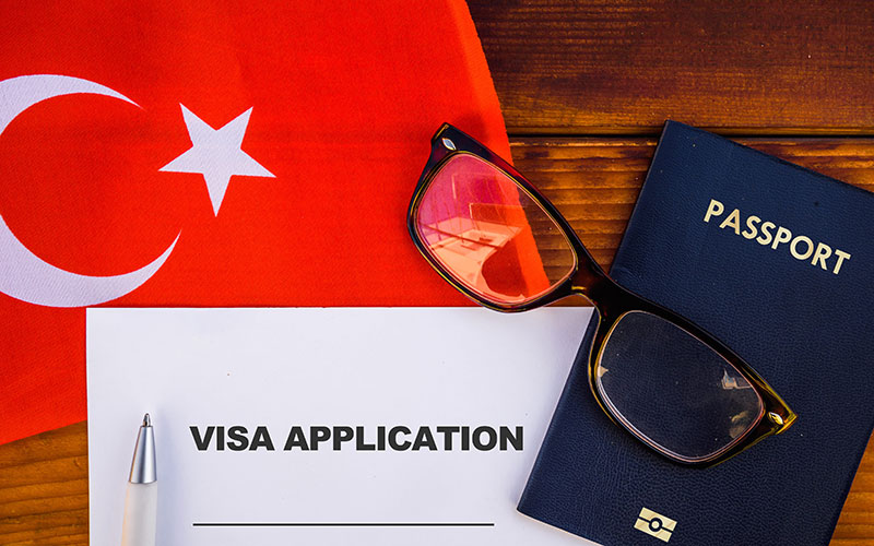 Turkey Flag, Passport, Visa Application on Table